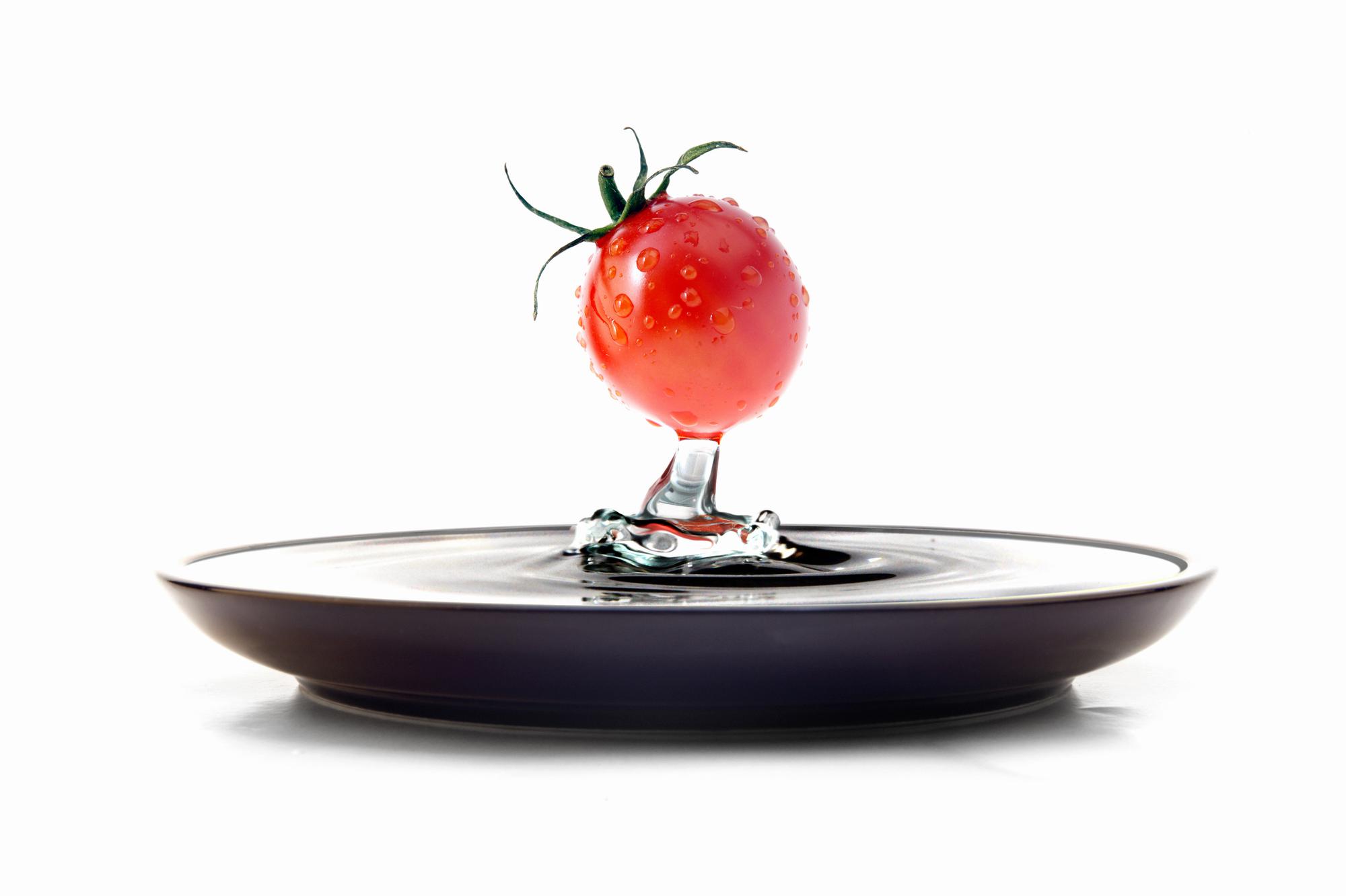 modern chef plating a dish in a futuristic kitchen